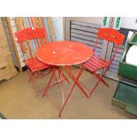 A FOLDING IRON & WOOD GARDEN TABLE AND TWO CHAIRS