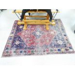 A PERSIAN RED AND BLUE GROUND RUG ( WORN ) (160X122)