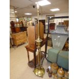 GILT BRASS STANDARD LAMP RAISED ON LIONS FEET