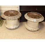 A PAIR OF STONE GARDEN URNS MISSING BASES