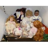 A QUANTITY OF MODERN BISQUE DOLLS WITH CLOTHES