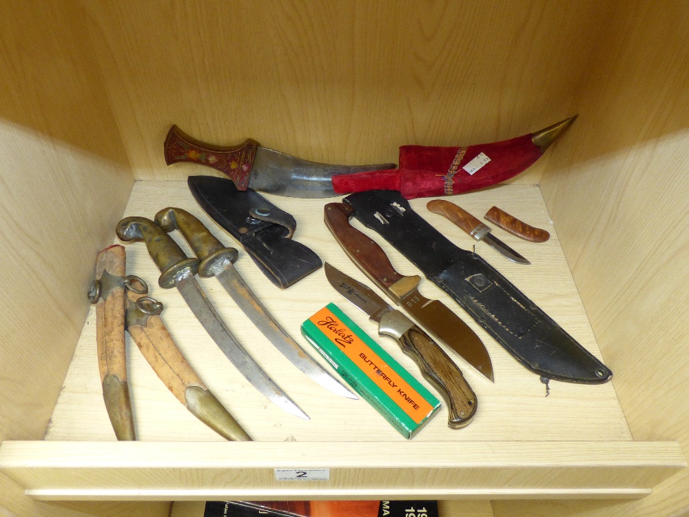 A SELECTION OF DAGGERS, KNIVES AND SHEATHS