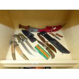 A SELECTION OF DAGGERS, KNIVES AND SHEATHS