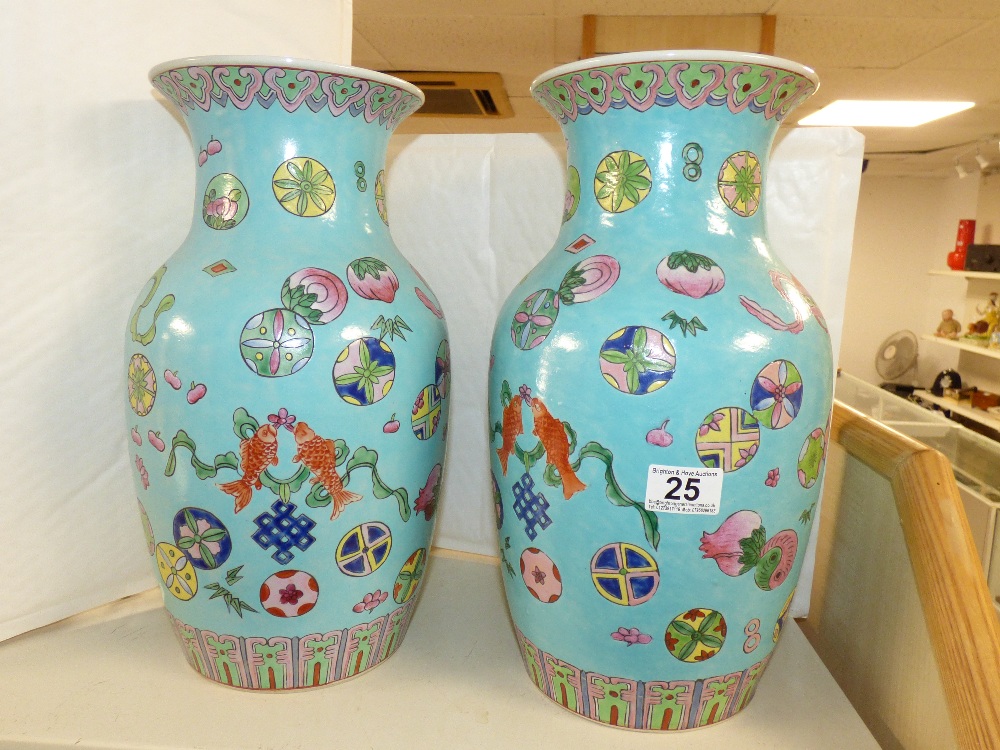 A PAIR OF TURQUOISE GROUND ORIENTAL VASES 38CM TALL