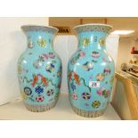 A PAIR OF TURQUOISE GROUND ORIENTAL VASES 38CM TALL