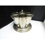 A SILVER PLATED 4 BOTTLE ART DECO STYLE WINE COOLER