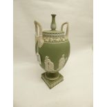 A 19TH CENTURY WEDGWOOD GREEN AND WHITE JASPER WARE TWIN HANDLED URN SHAPE VASE WITH RAISED