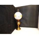 A BRASS OIL LAMP WITH SHADE