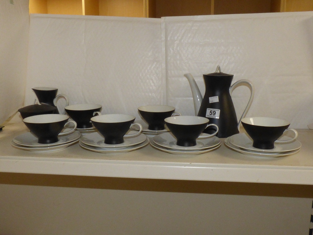 A ROSENTHAL BLACK AND WHITE TEA SET COMPRISING SIX CUPS AND SAUCERS, TEA COFFEE POT, MILK JUG AND