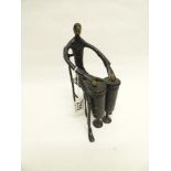 A 20TH CENTURY BRONZE FIGURE PLAYING DRUMS (23CMS)