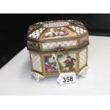 A 20TH CENTURY PORCELAIN CASKET WITH FIGURES AND FLORAL DECORATION WITH GILT METAL MOUNTS