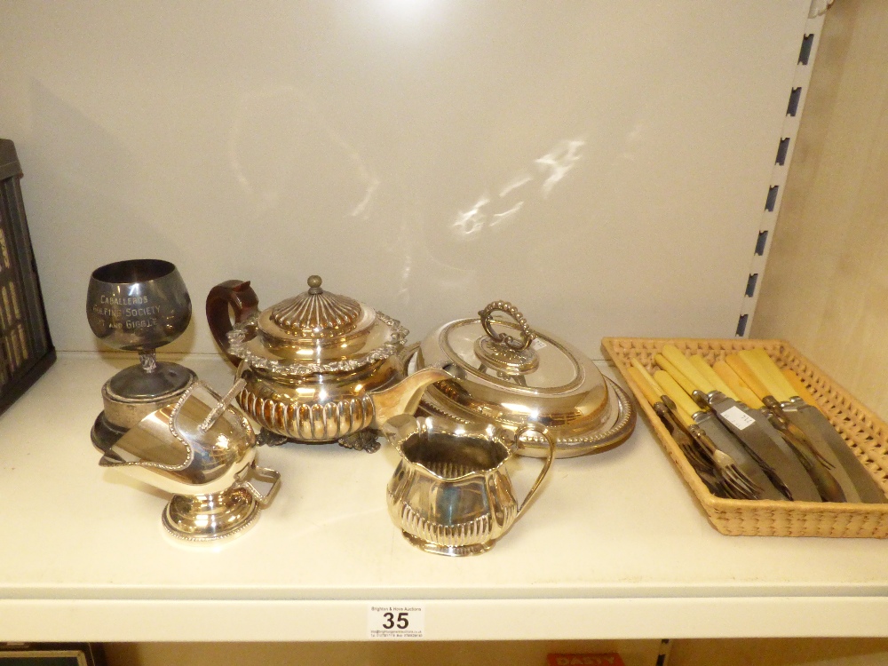 SILVER PLATED WARES INCLUDING A TEAPOT AND CUTLER, SUGAR SCUTTLE AND ENTRE DISH