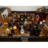 A LITE BOTTLE OF CROWN ROYAL CANADIAN WHISKY AND A QUANTITY OF MINIATURE SPIRITS INCLUDING KRAKEN