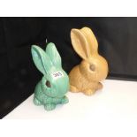 A LIGHT BROWN SYLVAC BUNNY AND AN UNMARKED GREEN BUNNY