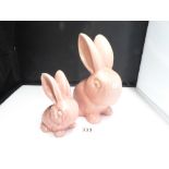 TWO PINK GLAZED RABBITS, UNMARKED BUT PROBABLY SYLVAC