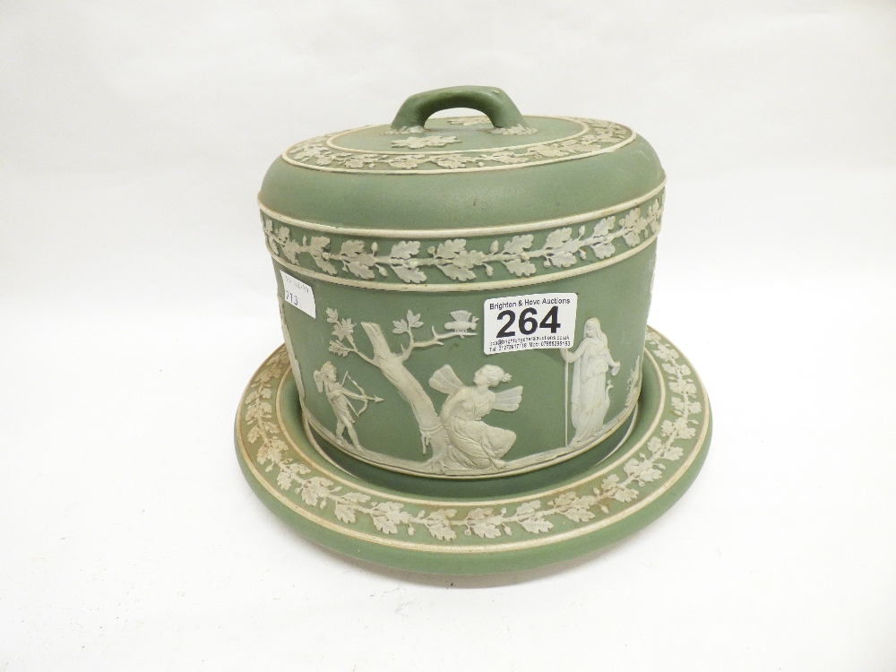 A WEDGWOOD GREEN AND WHITE JASPERWARE STILTON CHEESE DISH ON A STAND WITH RAISED DECORATION OF