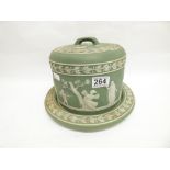 A WEDGWOOD GREEN AND WHITE JASPERWARE STILTON CHEESE DISH ON A STAND WITH RAISED DECORATION OF