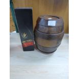 A REMY MARTIN FINE CHAMPAGNE COGNAC VSOP IN A BOX AND A REMY MARTIN WOODEN BARRELL GAMES COLLECTION