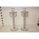 A RARE PAIR OF GEORGE III GLASS DOUBLE AIR TWIST CANDLESTICKS WITH ENGRAVED FOLIATE COLLAR DRIP PANS