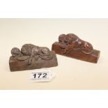 A PAIR OF 19TH CENTURY CARVED WOOD BLOCKS DEPICTING BRITISH LIONS, INSCRIBED ROMAN NUMERAL DATE TO