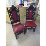 PAIR OF CONTINENTAL HEAVY CARVED HALL CHAIRS