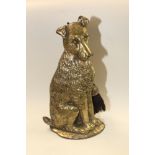 A 19TH CENTURY BRASS COMPANION SET IN THE SHAPE OF A TERRIER DOG WITH BRUSH AND SHOVEL