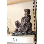 AN ORNAMENTAL CARVED WOODEN FIGURE A/F