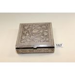 A PERSIAN 875 GRADE SILVER BOX WITH HEAVILY EMBOSSED AND ENGRAVED DECORATION THROUGHOUT, 16.5CM