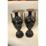 A PAIR OF CAST METAL URNS, EACH WITH GILDED METAL TWIN HANDLES 36.5CM HIGH