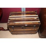 19TH CENTURY WOODEN BOUND TRUNK ON CASTORS