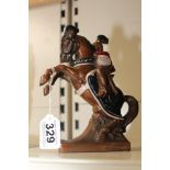 A PAINTED BRASS FIGURE OF A MEDIEVAL JOUSTER ON A REARING HORSE MISSING HIS JOUST