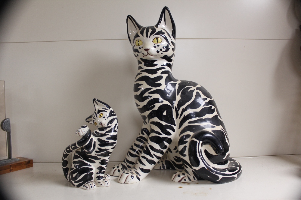 TWO 1960S MANICIOLI ITALIAN POTTERY BLACK AND WHITE CATS, ONE 58CM TALL, THE OTHER 21CM TALL