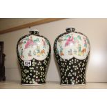 A PAIR OF ORIENTAL HAND PAINTED BULBOUS VASES FEATURING GURU AND CHILDREN, 31CM HIGH