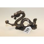 A METAL FIGURE OF AN ORIENTAL DRAGON, 17.5CM WIDE