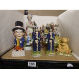 TWELVE REPRODUCTION STAFFORDSHIRE CERAMIC FIGURES PLUS TWO IN THE ORIENTAL STYLE