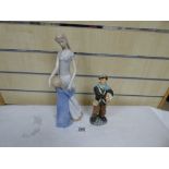 ROYAL DOULTON “NEWSBOY” FIGURE, HN 2244, TOGETHER WITH A LLADRO STYLE FIGURE OF A MOTHER AND CHILD