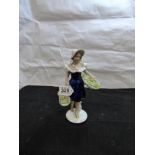 ROYAL DUX PORCELAIN FIGURE DEPICTING A LADY CARRYING FLOWER BASKETS NUMBER 186 25 CMS HEIGHT