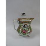 PRIVATE COLLECTION: MID 19TH CENTURY CHINESE CANTON FAMILLE ROSE POURING JUG, RAISED UPON THREE