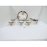 A ROYAL CROWN DERBY TEA SET FOR SIX INCLUDING CUPS, SAUCERS, SIDE PLATES, SUGAR BOWL, JUG AND CAKE