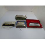 THREE HOHNER HARMONICAS, INCLUDING TWO CHROMONICA 270 AND "THE HOHNER BAND" TOGETHER WITH A PARROT