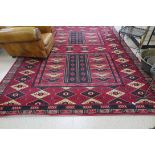 A LARGE RUG, 301CM BY 206CM