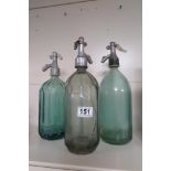 THREE VINTAGE GLASS SODA SIPHONS, ONE BEING BY “PRODCOOP SIBIU”