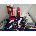A NINTENDO WII GAMES CONSOLE, CONTROLLERS AND OTHER RELATED ITEMS