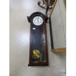 A MAHOGANY CASED WALL CLOCK