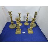 THREE SETS OF BRASS CANDLESTICKS, LARGEST 26CM HIGH