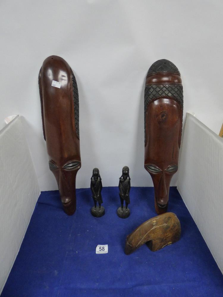 FIVE WOODEN TRIBAL ART CARVINGS, COMPRISING THREE FIGURES AND TWO WALL HANGINGS, LARGEST 56CM LONG