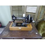 A CASED VINTAGE FRISTER & ROSSMAN SEWING MACHINE