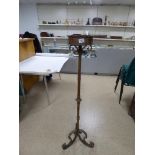 A LARGE PICKET CANDLE STICK HOLDER, 130.5CM HIGH, TOGETHER WITH AN INDUSTRIAL STYLE LAMP WITH