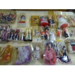 A LARGE QUANTITY OF MINIATURE DOLLS MANY IN TRADITIONAL NATIONAL COSTUMES TOGETHER WITH DOLLS