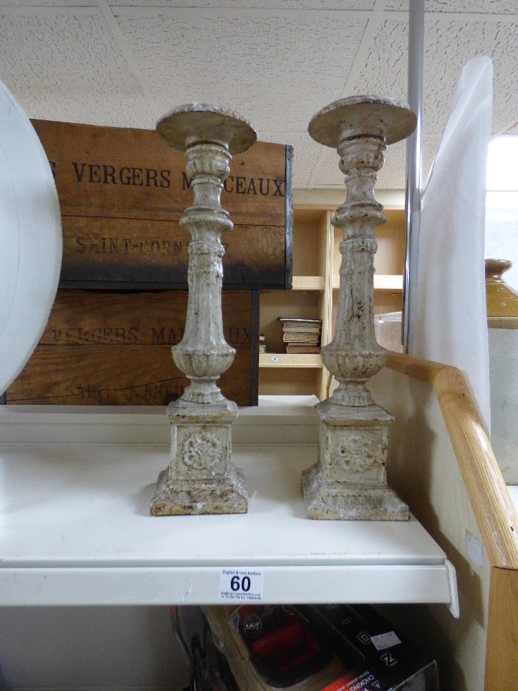 A PAIR OF HEAVY CAST METAL CANDLESTICKS, 45CM HIGH